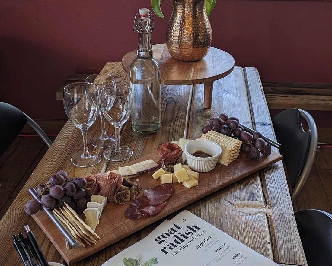 A Goat & The Radish charcuterie board with their catering menu